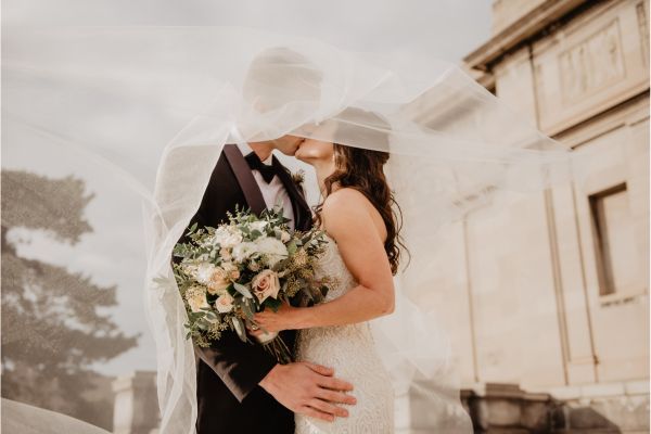 couple kissing on their wedding day