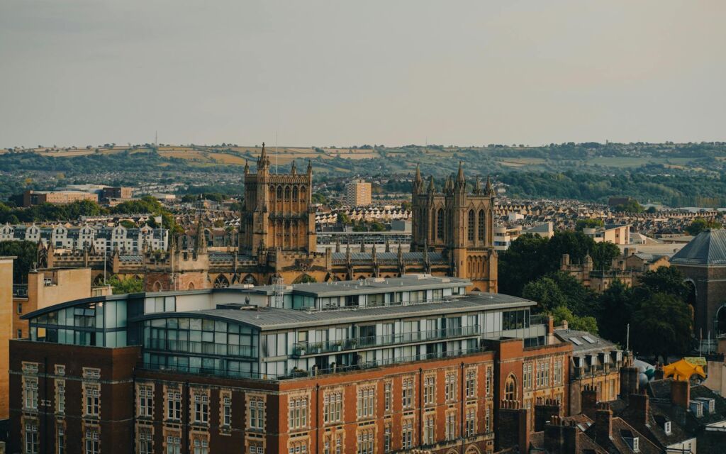 Scenic view of a historic cathedral amidst modern urban architecture in a vibrant city.