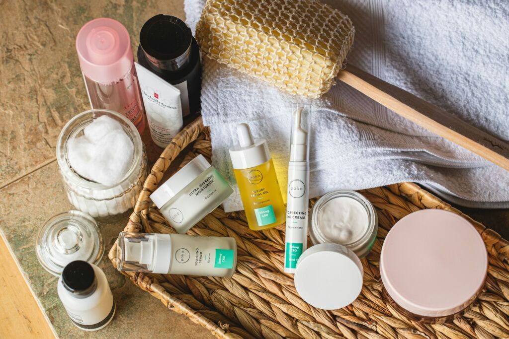 assorted skincare and beauty plastic bottles on brown woven basket including hyaluronic acid