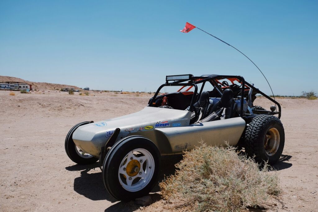 a dune buggy is parked on the beach in aruba