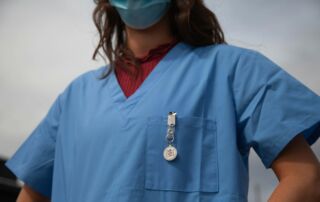 woman in red shirt wearing blue goggles