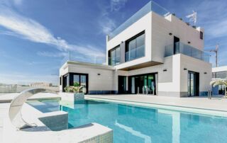luxury home white concrete building under blue sky during daytime