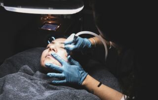 person fixing someone's face