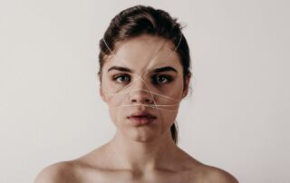 naked top woman with string with her face