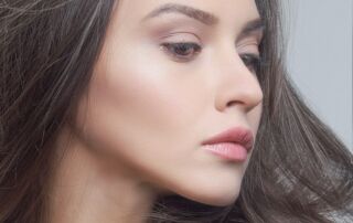 a close up of a woman with long hair