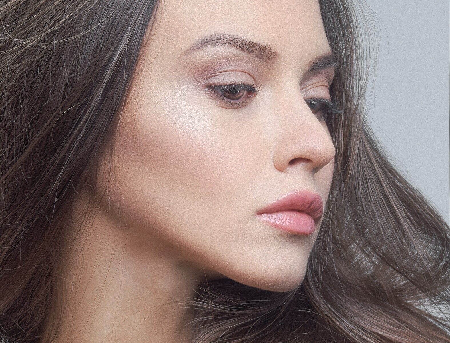 a close up of a woman with long hair