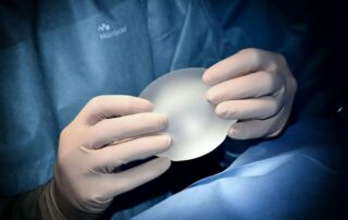 person holding white heart shaped ornament